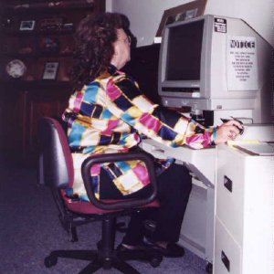 Volunteer Jean Cochran using Microfilm reader in research room at EVHS